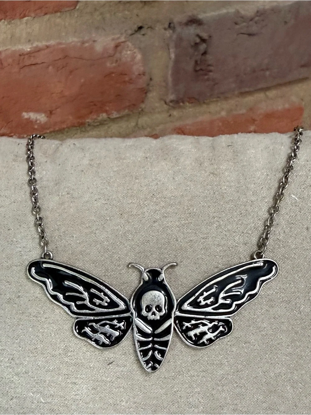 Silver-Tone Skull Moth Necklace in Black Enamel